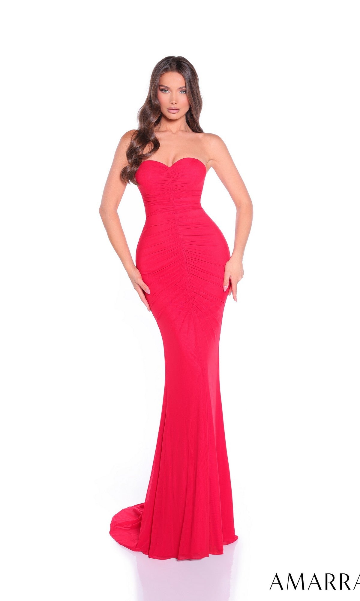A woman models the Amarra 89510 Long Prom Dress, a strapless red gown with a ruched, form-fitting bodice and gathered detailing, standing against a plain white background.